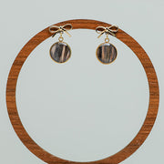 Mini Bow Posts on a circular wooden stand on a white background.  