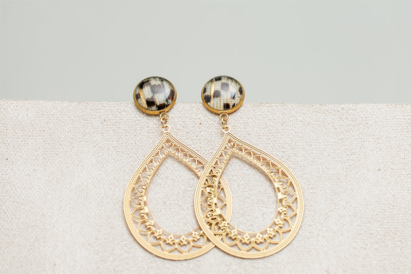 Teardrop Lace Earrings on a white and cream background.