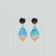 A pair of Seas the Day Earrings on a white background. 