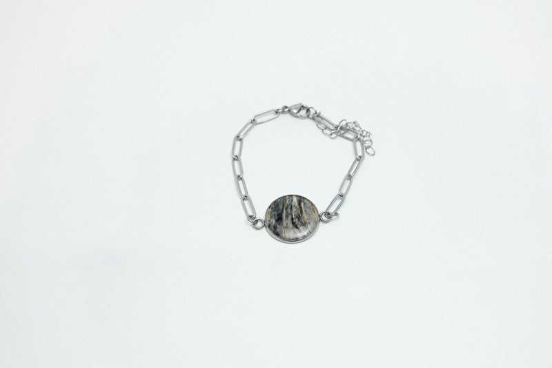 A Silver Paperclip Bracelet on a white background.