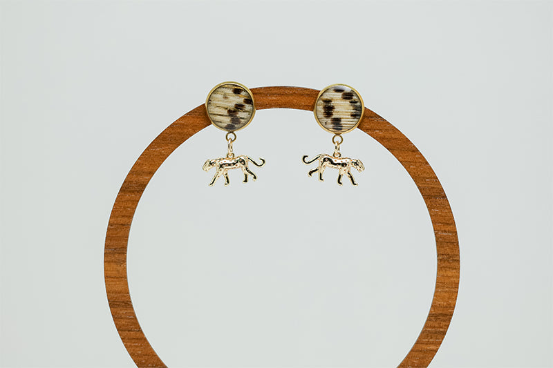 Jaguar Jubilee Posts on a circular wooden stand on a white background. 