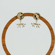 Jaguar Jubilee Posts on a circular wooden stand on a white background. 