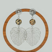 Monstera Leaf Mandala Drops on a circular wooden stand on a white background.  