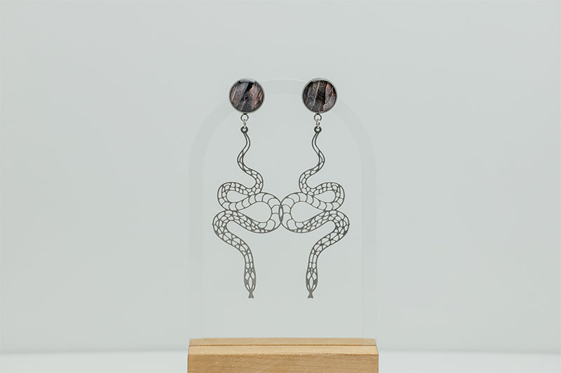 Snake Earrings on a white background.