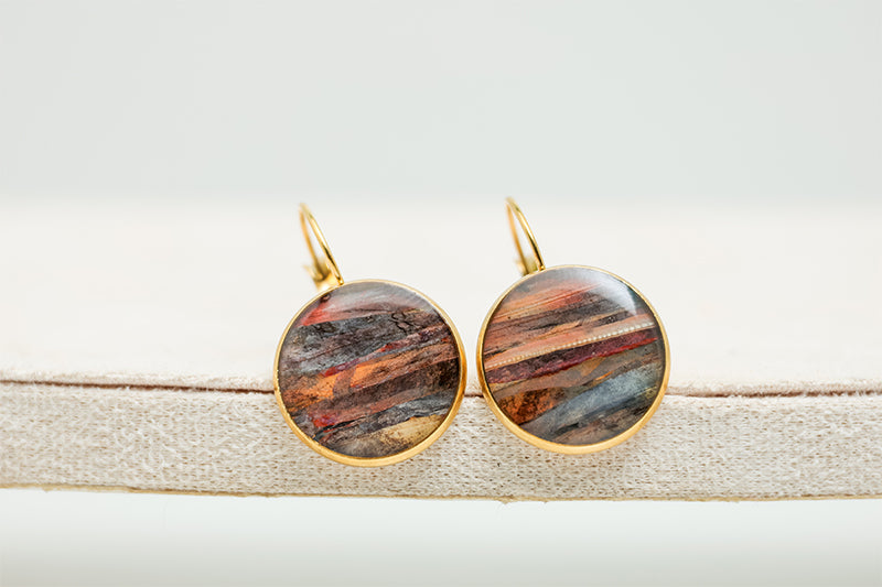 Close-up of a pair of French Hook Earrings on a white background.