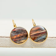 Close-up of a pair of French Hook Earrings on a white background.