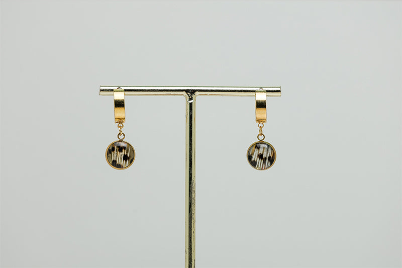 Golden Huggies on a gold stand on a white background.