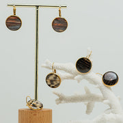 Three pairs of French Hook Earrings on a white background with white coral .