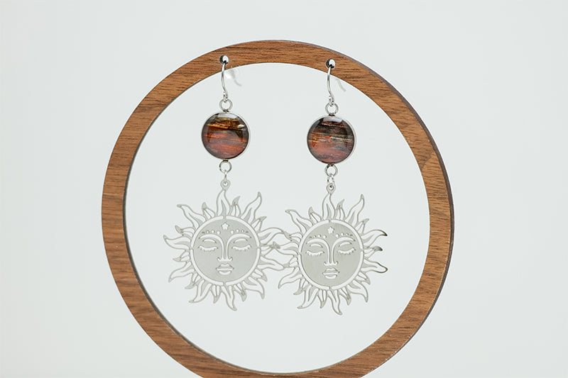 Sunshine on a Cloudy Day Earrings on a circular wooden stand on a white background.  