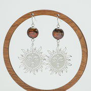 Sunshine on a Cloudy Day Earrings on a circular wooden stand on a white background.  