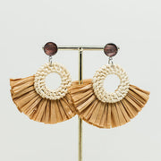 Boho Rattan Statement Earrings on a gold stand on a white background.