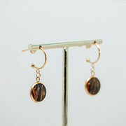 Gold Open Hoop Posts on a gold stand on a white background.