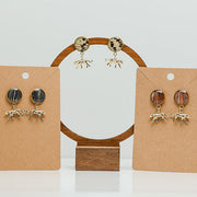 Three pairs of Jaguar Jubilee Posts on stands on a white background.  