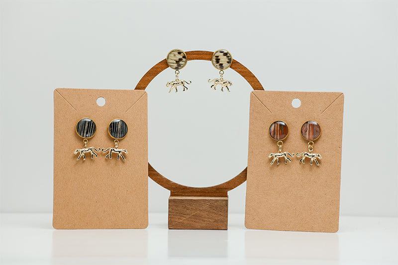 Three pairs of Jaguar Jubilee Posts on stands on a white background.  