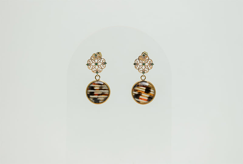 Gold Enchanted Emerald Earrings on a white background. 