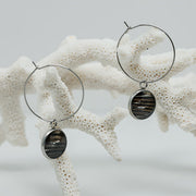 Silver Hoops on white coral on a white background.  
