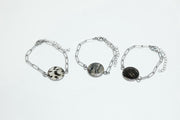 Three Silver Paperclip Bracelets on a white background.