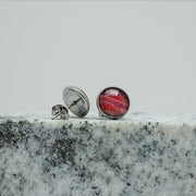 Medium Studs on black and white marble on a white background.