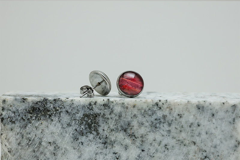 Medium Studs on black and white marble on a white background.