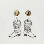 Cowboy boot lionfish earrings on a light gray background
