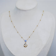 Necklace with a pendant on a mannequin bust against a gray background