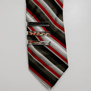 Striped tie with three tie clips on a light gray background