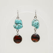 Turquoise and lionfish earrings on a white background
