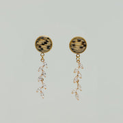 Cascading Diamond Earrings on a white background.