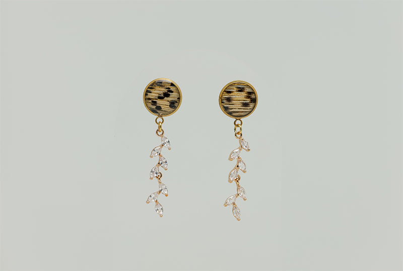 Cascading Diamond Earrings on a white background.