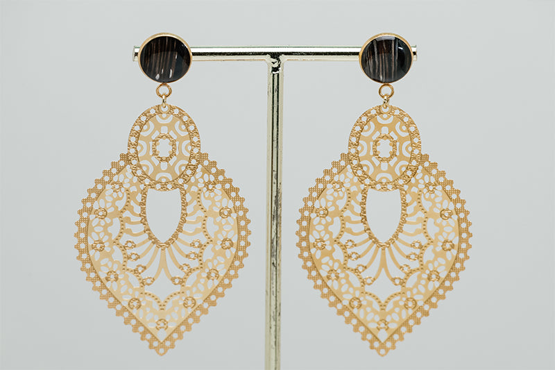 Golden Hour Lace Earrings on a gold stand on a white background.
