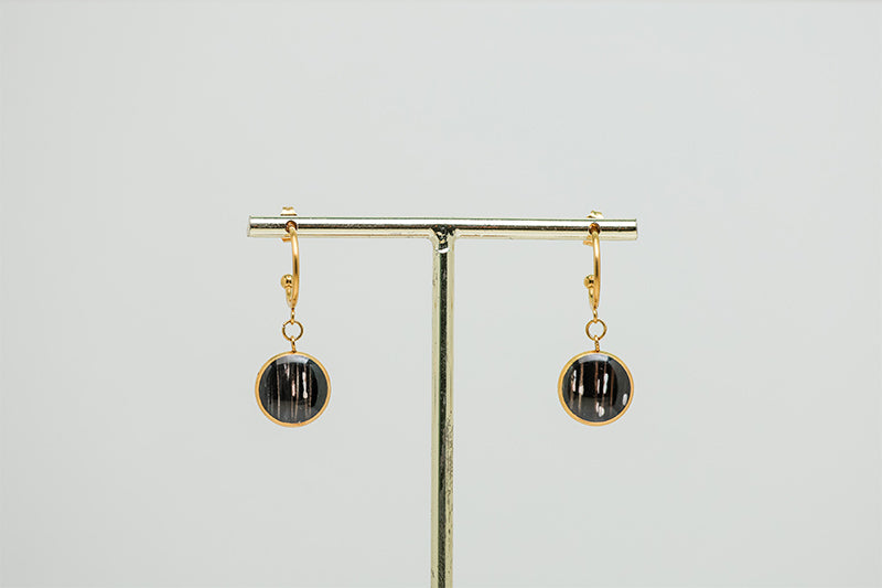 Gold Open Hoop Posts on a gold stand on a white background.