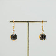 Gold Open Hoop Posts on a gold stand on a white background.