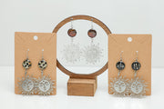 Three pairs of Sunshine on a Cloudy Day Earrings on stands on a white background.  