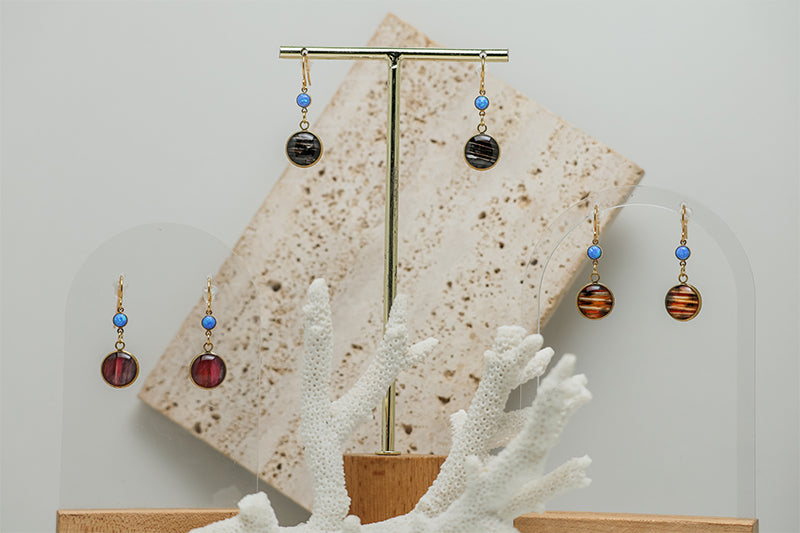 Three pairs of Petite Caribbean Blue Opal Earrings with white marble and white coral  on a white background.