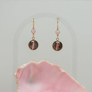 Seashell Pink Opal Earrings on a white background with a pink shell at the bottom of the image. 