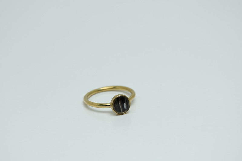 A Mini Gold Ring on a white background.