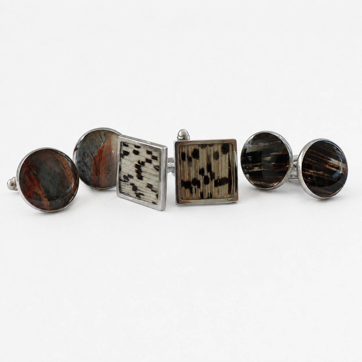 Two Round and one Square lionfish Cuff Link Sets on a white background.